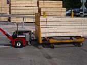 Power Pusher moving 2,500Kg timber trolley in sawmill