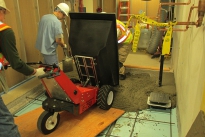 Tipping concrete from MUV electric wheelbarrow using the electric dump